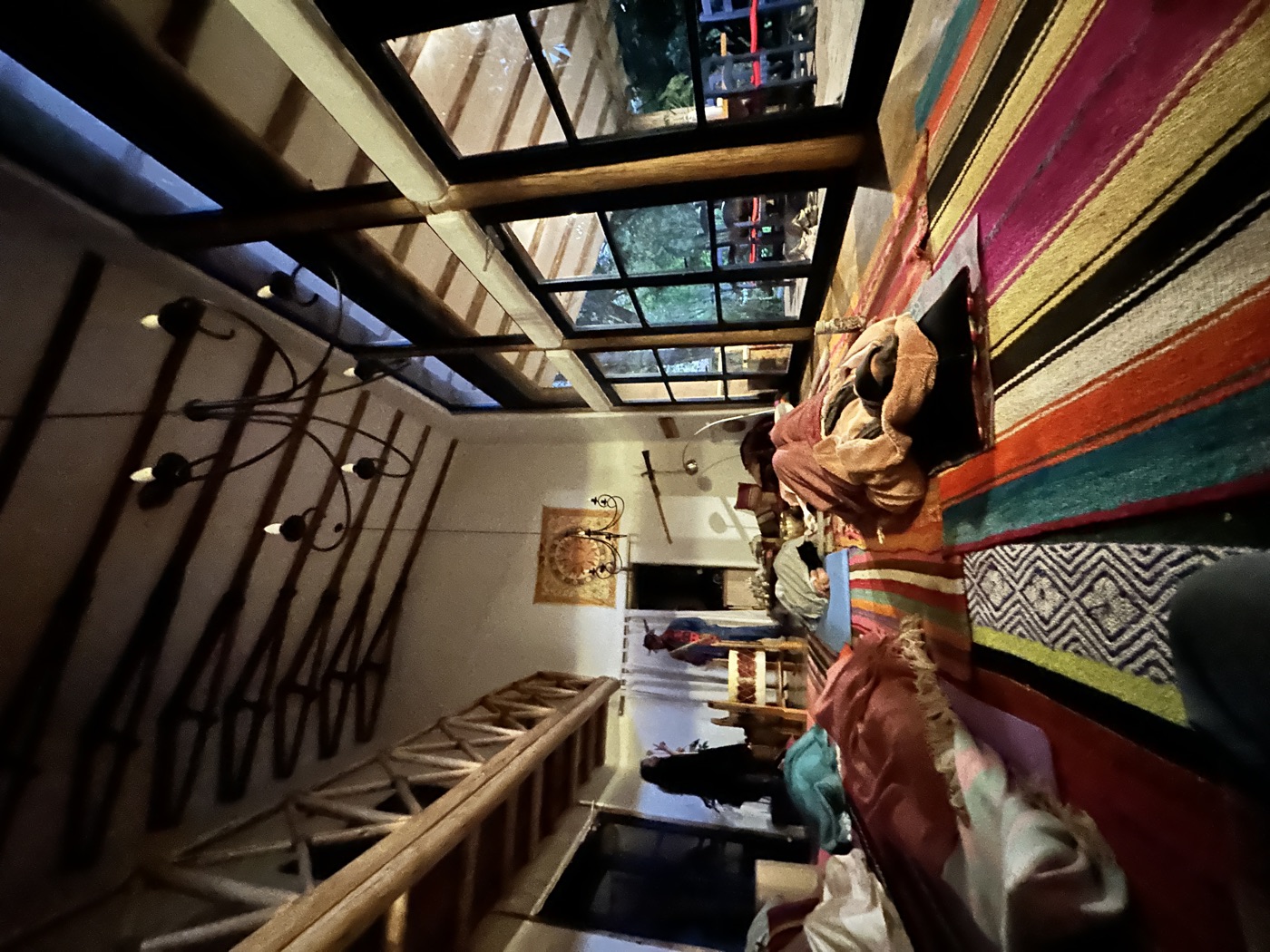The wooden shala with cushions and woven rugs
